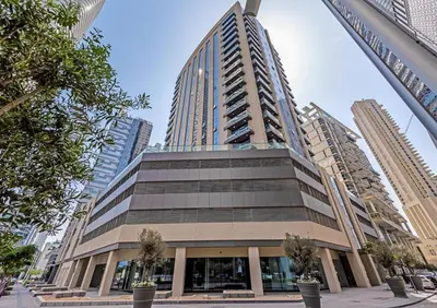 a tall building in a city with tall buildings at Urban Elegance 1BDR in Dunya 06 in Dubai