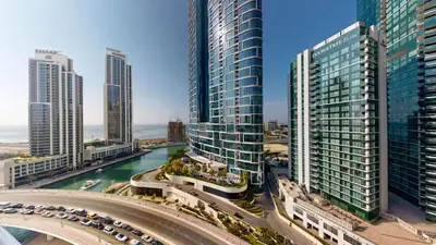 a view of a city with tall buildings and a freeway at Vacationer l Cozy 1 Bed l Partial Sea View l Prime Location in Dubai