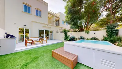 an exterior view of a house with a backyard with a hot tub at Vacationer l Opulent 2 Bedroom Villa l Private Plunge Pool in Dubai