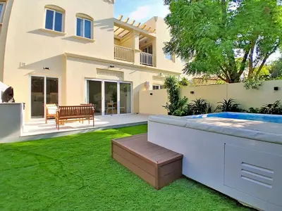a house with a swimming pool in a yard at Vacationer l Opulent 2 Bedroom Villa l Private Plunge Pool in Dubai