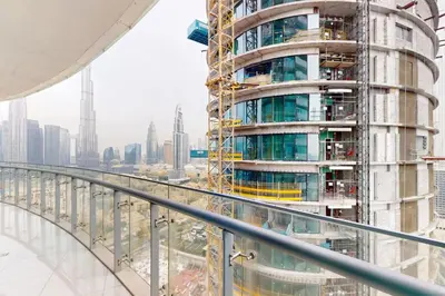 a tall building under construction in a city at Vacationer I Premium 2 Bedroom Apartment I Iconic Burj Khalifa View I Downtown I Distinction Tower in Dubai
