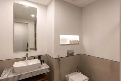 a bathroom with a sink and a toilet at Jumeirah Stay Near To Beach in Dubai