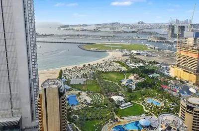a view of a resort with a beach and buildings at Ultra-Luxury 3BR -Full Sea & Marina Views - JBR in Dubai