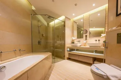 a bathroom with a tub and two sinks and a shower at City View 1 BR - Creek Heights, Upgraded by UDH in Dubai