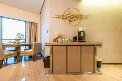 a dining room with a table with a coffee machine at City View 1 BR - Creek Heights, Upgraded by UDH in Dubai