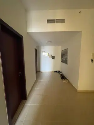 an empty hallway with shoes on the floor at Two Bedroom Apartment with Excellent Location in Dubai