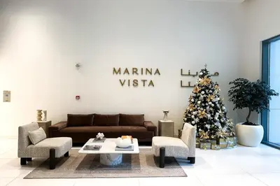a living room with a christmas tree and a couch at Sea View Apartment at Emaar Beachfront by KeyRock in Dubai