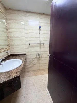 a bathroom with a sink and a shower at Bienvenue Homes in Dubai