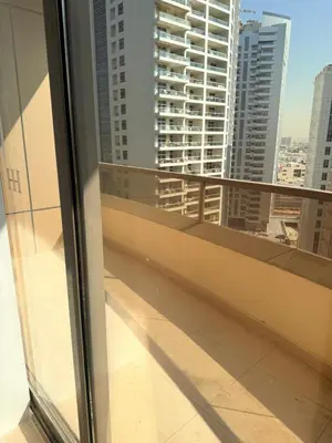 a balcony with a view of a city at Bienvenue Homes in Dubai