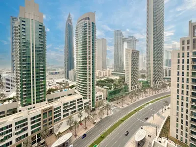 a view of a city with tall buildings at Dream Shoma-2BR - Pool - Walk to Burj Khalifa in Dubai