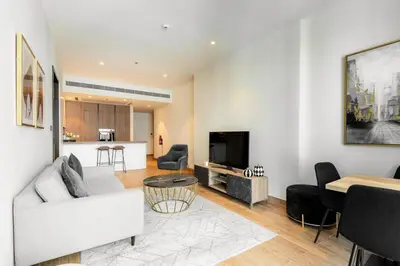 a living room with a couch and a table at CitiHome Elegant 1BR Jumeirah Living Dubai Marina in Dubai