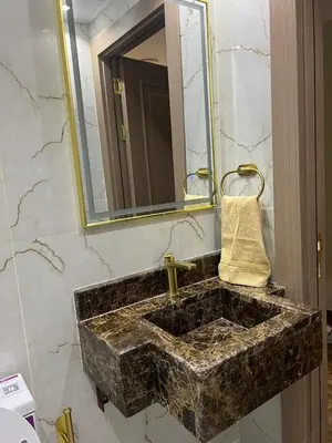 a bathroom with a marble sink and a mirror at Upgraded Sea View 1BR Dubai Marina, Walk Metro & JBR in Dubai
