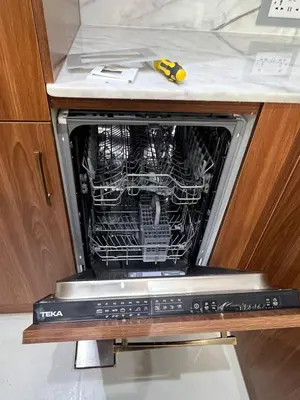 a dishwasher with its door open in a kitchen at Upgraded Sea View 1BR Dubai Marina, Walk Metro & JBR in Dubai