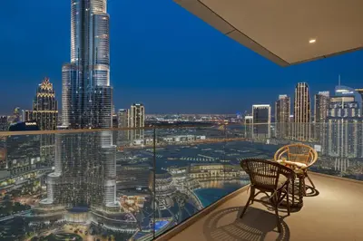 a room with a view of a city skyline at Luxury 4BR Apartment Burj Khalifa & Mall Views in Dubai