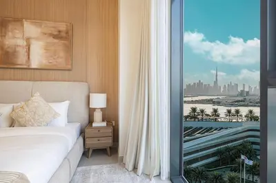 a bedroom with a bed and a view of a city at 3 Bedroom Apartment with Full Skyline Views In Creek Harbour in Dubai