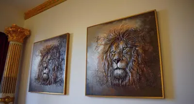 two framed pictures of a lion on a wall at ROME x DXB with Full Burj and Fountain View in Downtown Dubai in Dubai