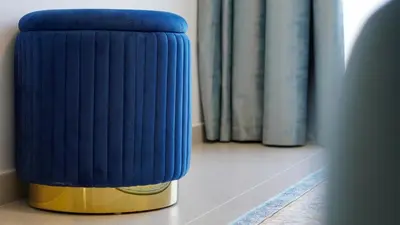 a blue radiator in a room with books at ROME x DXB with Full Burj and Fountain View in Downtown Dubai in Dubai