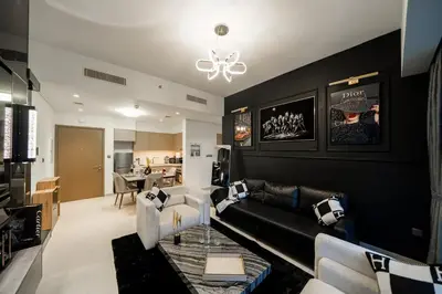 a living room with a couch and a table at Noir x DXB a High Floor 1BDR in Downtown Dubai in Dubai