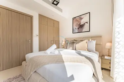 a bedroom with two white beds in a room at Well-Connected, Family-Friendly Community with Resort-Style Amenities, Minutes from Major Malls and Al Maktoum International Airport - Damac Hills 2 Amargo, Damac Hills 2 by Deluxe Holiday Homes in Dubai