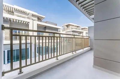 an empty balcony of an apartment building with a railing at Well-Connected, Family-Friendly Community with Resort-Style Amenities, Minutes from Major Malls and Al Maktoum International Airport - Damac Hills 2 Amargo, Damac Hills 2 by Deluxe Holiday Homes in Dubai