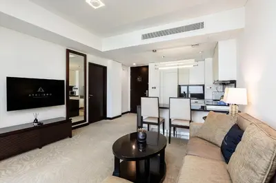 a living room with a couch and a table at Marriott 1BR Apartment with Dubai Marina View in Dubai