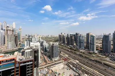 an aerial view of a large city with buildings at Marriott 1BR Apartment with Dubai Marina View in Dubai