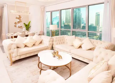 a living room with white furniture and a large window at Elite Royal Apartment - Sky Series - Panoramic New Fountain & Burj Khalifa View - Nebuchadnezzar II in Dubai