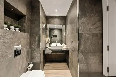 a bathroom with a sink and a toilet and a mirror at Ahlan Marhaba Marina JBR in Dubai