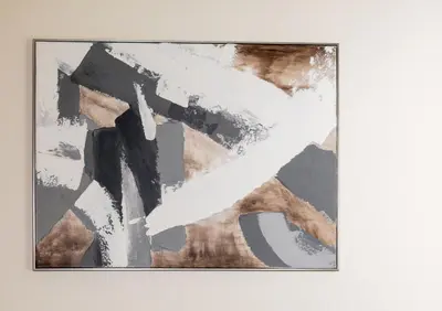 a painting on a white wall at Modern Studio Apartment - Binghatti Azure 633 in Dubai