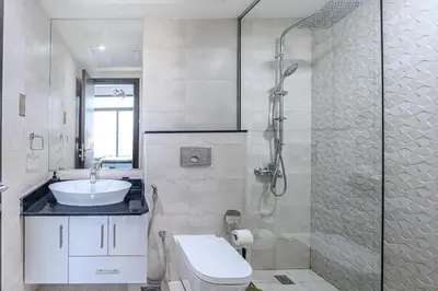 a bathroom with a shower and a toilet and a sink at Apartment-Private Bathroom in Dubai