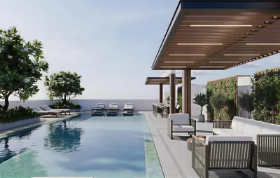 a swimming pool with lounge chairs and a swimming poolvisor at Near Museum of the Future - Homey Apartment-Jumeirah Garden in Dubai