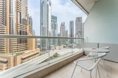 a balcony with a view of a city skyline at Charming Studio, Easy Access to Beach - Botanica Tower, Dubai Marina by Deluxe Holiday Homes in Dubai
