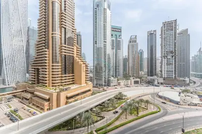 a city with tall buildings and a highway at Charming Studio, Easy Access to Beach - Botanica Tower, Dubai Marina by Deluxe Holiday Homes in Dubai