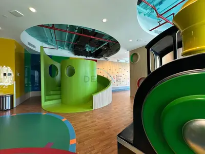 a room filled with lots of green and yellow at Burj Khalifa View, Easy Access to Dubai Mall and Burj Khalifa - Imperial Avenue, Downtown Dubai by Deluxe Holiday Homes in Dubai