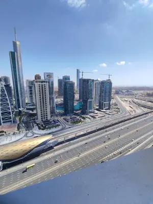 an overhead view of a city with a highway at Spacious Master Bedroom with Balcony Horizon Tower, Dubai Marina in Dubai