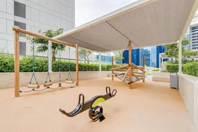 a group of swings on a stage in a building at Canal View Retreat in Business Bay in Dubai