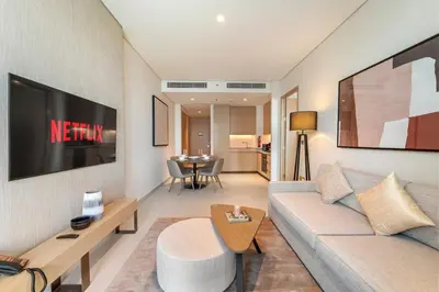 a living room with a couch and a table at Vida Residences Dubai Mall Spacious 1BR Apartment in Dubai