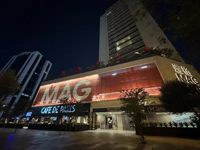 a building with a large sign on the side of it at MAG 318 Luxury Studio Resort Style Amenities in Dubai