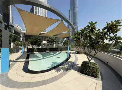 a swimming pool in a building with a building at Ultra-Luxury 2BR with Burj Khalifa view Downtown in Dubai