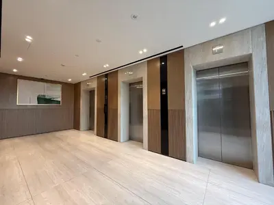 a lobby with a row of elevators in a building at Mahenti - Stylish Urban Studio with Burj View in Dubai