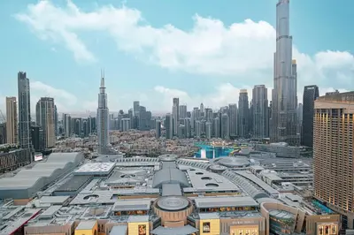 an aerial view of a city with tall buildings at Spacious 4BR for 12 Burj View PS5 Dubai Mall in Dubai