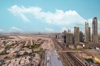an aerial view of a city with tall buildings at Spacious 4BR for 12 Burj View PS5 Dubai Mall in Dubai