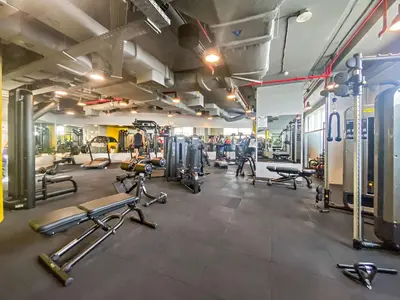 a gym with several treadmills and cardio machines at Silkhaus 2BDR Heart of DIFC in Sky Gardens in Dubai