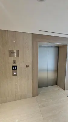 an empty room with a glass door in a building at Luxury Studio with Burj Khalifa View in Dubai