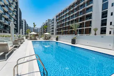 a swimming pool in the middle of a building at Luxury Studio with Burj Khalifa View in Dubai