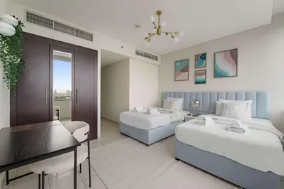 a hotel room with two beds and a piano at Silkhaus Expansive 2BDR in DIFC Sky Gardens in Dubai