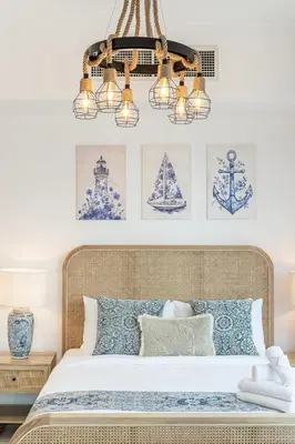 a bedroom with a bed with blue and white pillows at Airstay - Full Marina Views - Coastal Studio - Monthly Offer Available! in Dubai