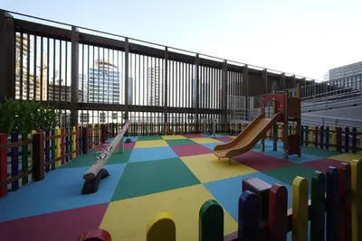 a childrens playground with a slide and a slideintend at Elegant 1BR with Balcony in West Five Business Bay in Dubai