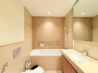 a bathroom with a tub and a sink at Luxury Burj Khalifa View Downtown Residence at Burj Vista Apartment in Dubai