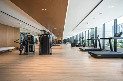 a gym with treadmills and ellipticals in a building at Trillionaire Bayhouse Chic Studio - Jacuzzi with views, Pool and Gym in Dubai